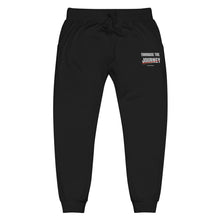 Embrace the Journey Joggers in Black — front view with embroidered left-thigh design