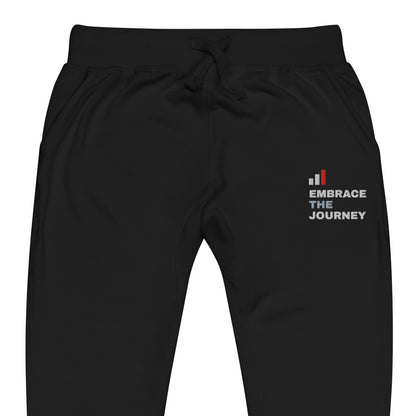 Embrace the Journey Clean Stack Joggers in Black — close-up of the embroidered Clean Stack logo at the left thigh