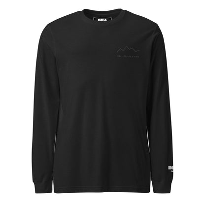 One Step at a Time Long Sleeve T-Shirt in Black Heather — front view with tonal charcoal left-chest mountain print