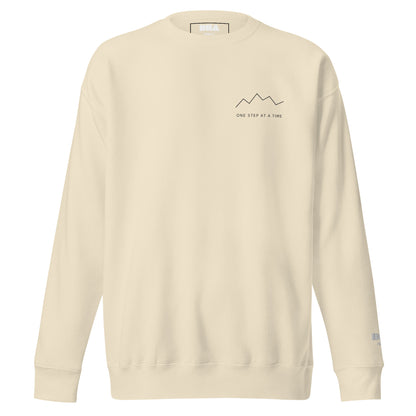 One Step at a Time Crewneck Sweatshirt in Bone — front view with charcoal left-chest mountain print