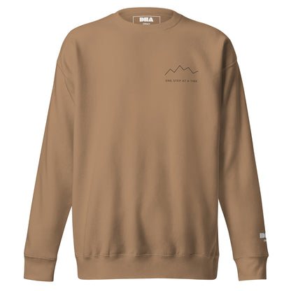One Step at a Time Crewneck Sweatshirt in Latte — front view with charcoal left-chest mountain print